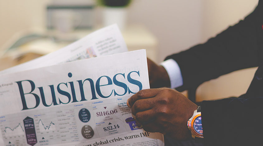 businessman reading newspaper